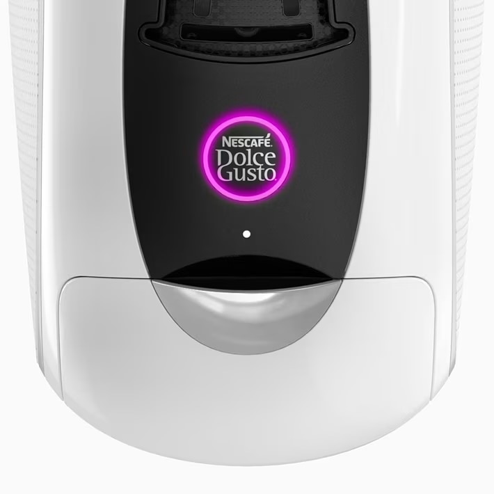 Machine NEO Latte blanche avec bouton de démarrage illuminé en violet.
